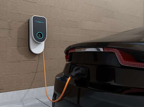 An EV being charged at home via wall charger