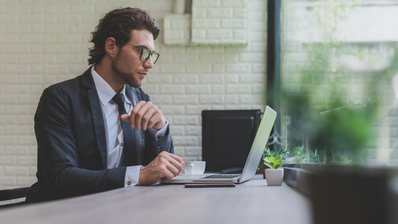 professional man using laptop broadband cafe