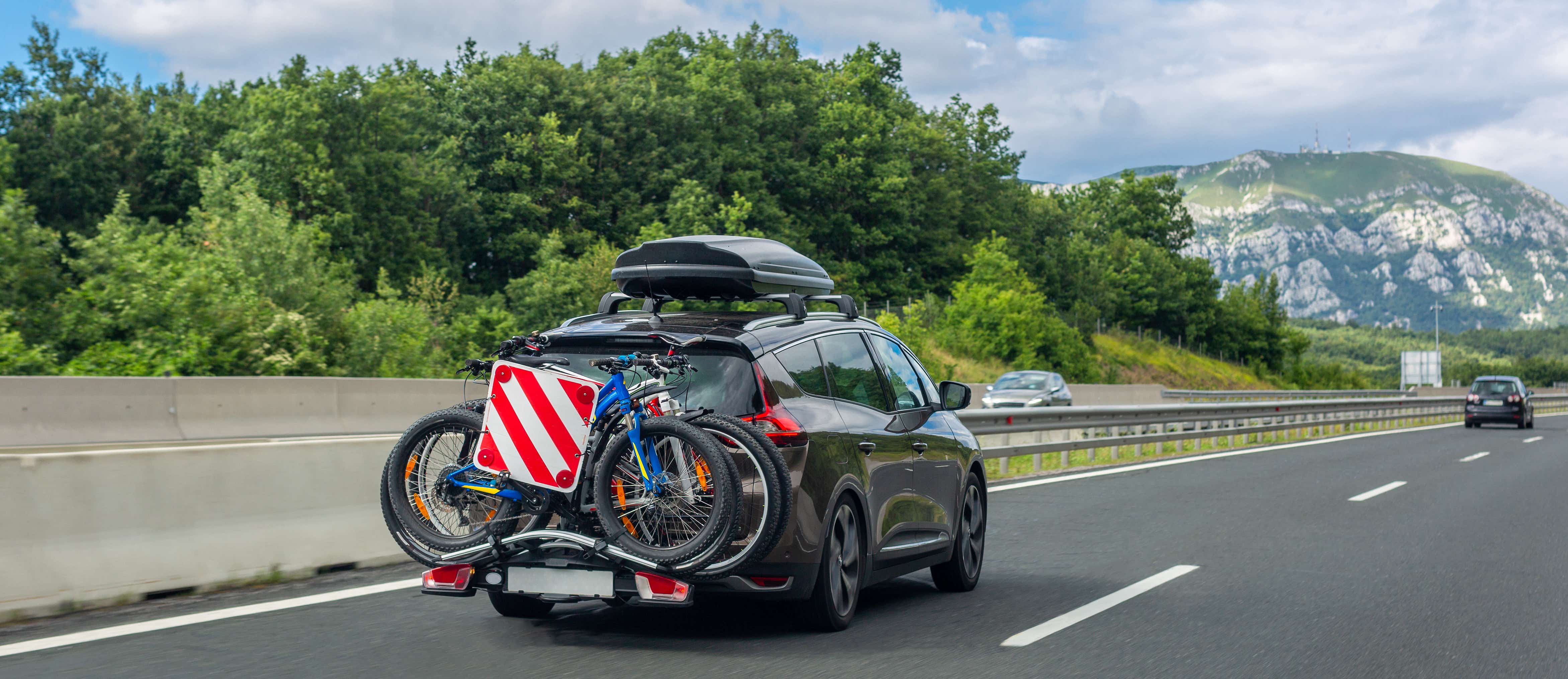 Car with roof box and bike rack 