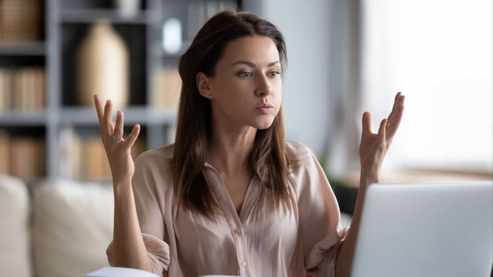 Woman looking very frustrated at her broadband connection