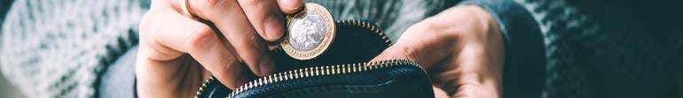Dropping £1 coin into a purse
