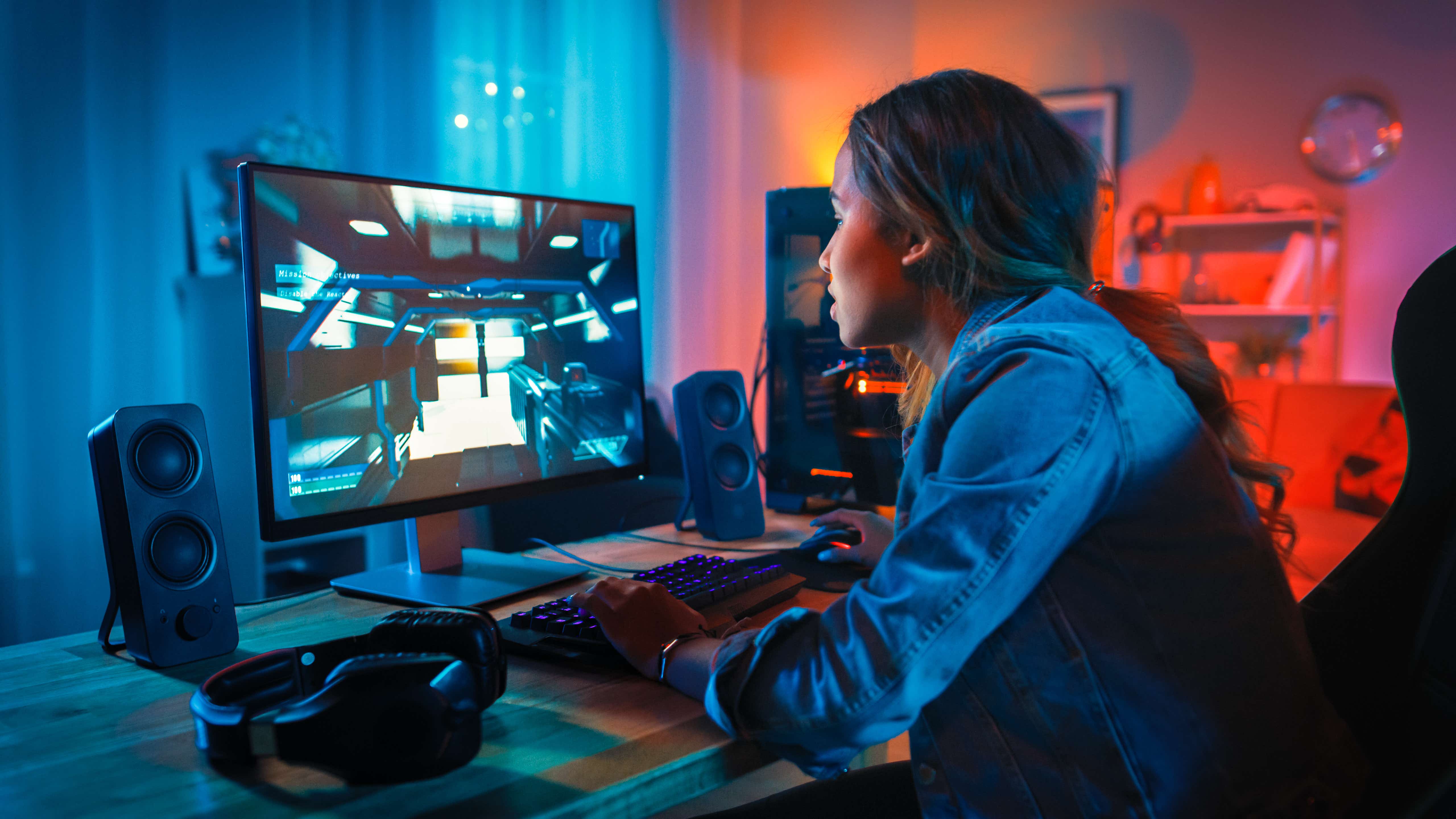 Picture of a woman gaming on a computer