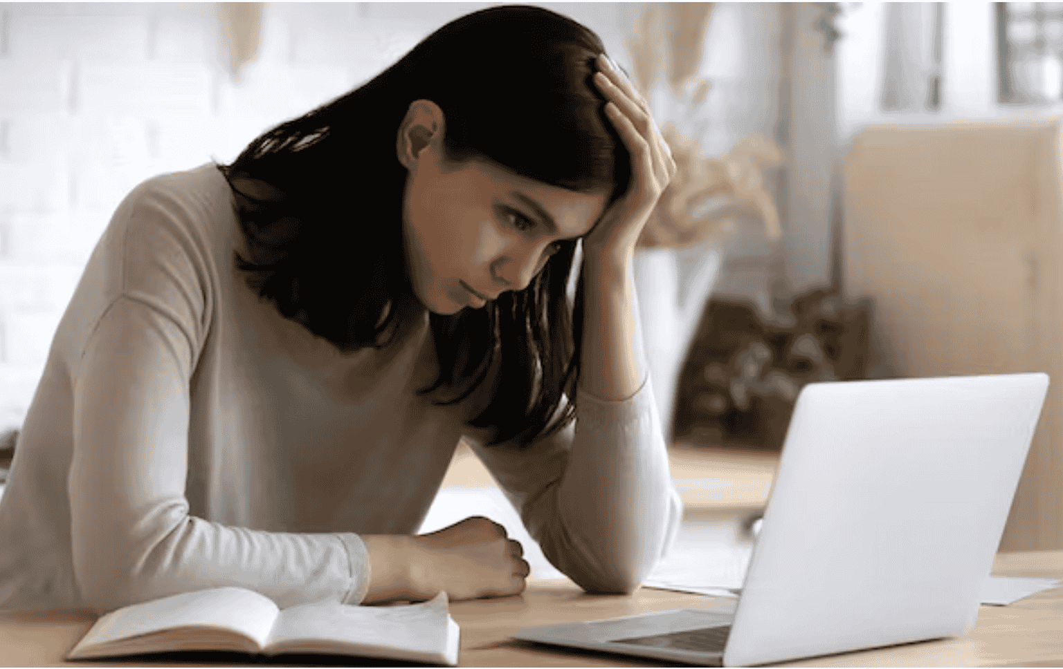 Woman stressed out on laptop