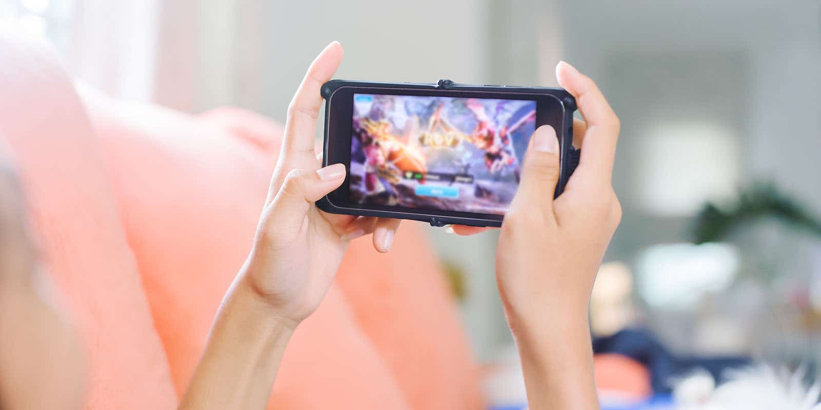 girl playing an online game on her mobile using upload speeds