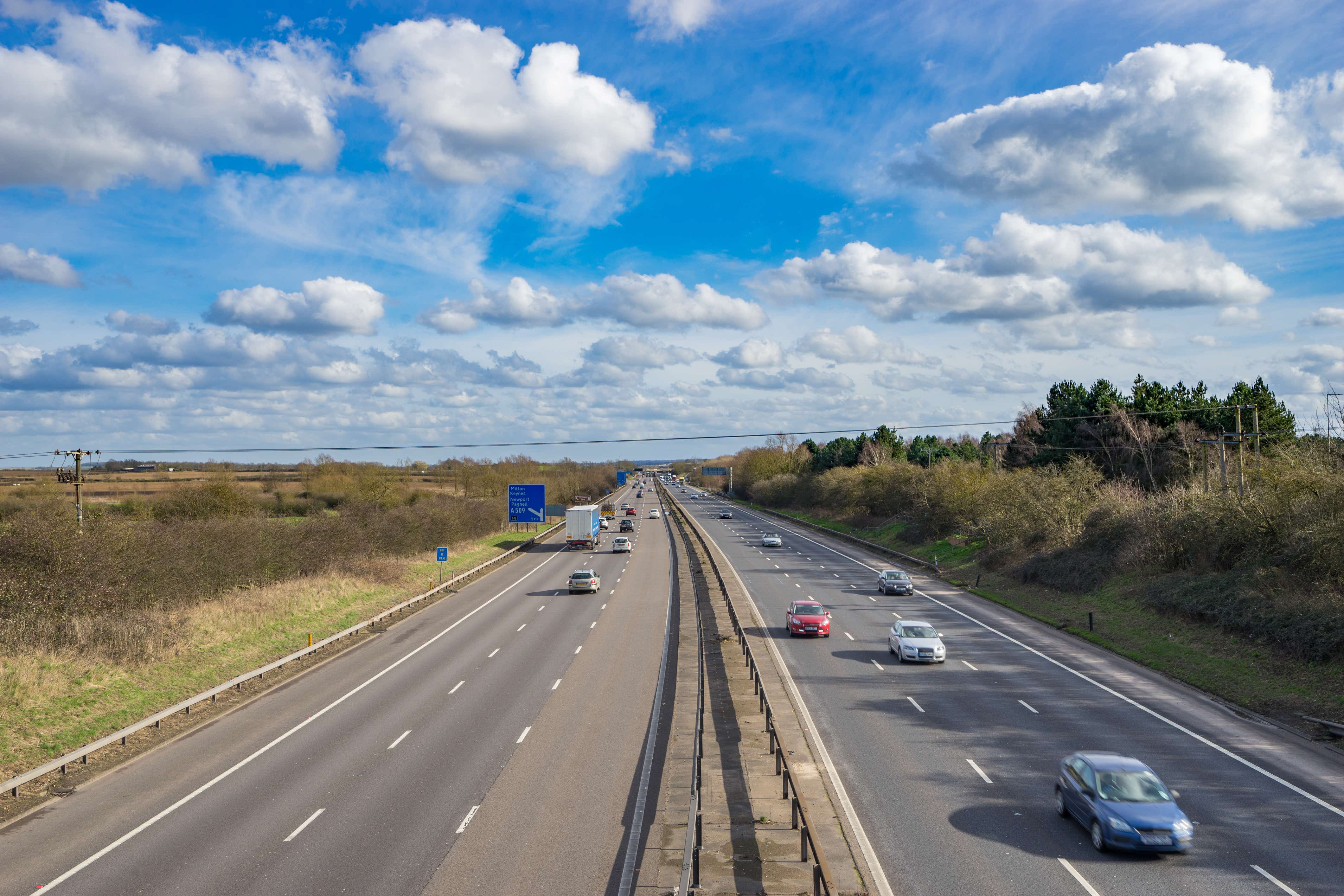 M1 motorway in UK with blue sky at sunny day