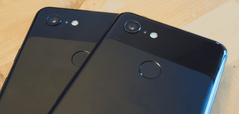 Google Pixel 3 and 3XL backs black in hand close up lens hero size