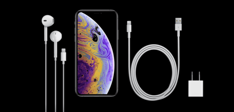 iPhone Xs unboxed with charger and headphones hero