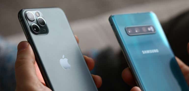 iPhone and Samsung backs in hand