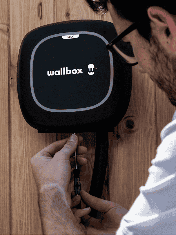 Technician installing a Wallbox Pulsar Max