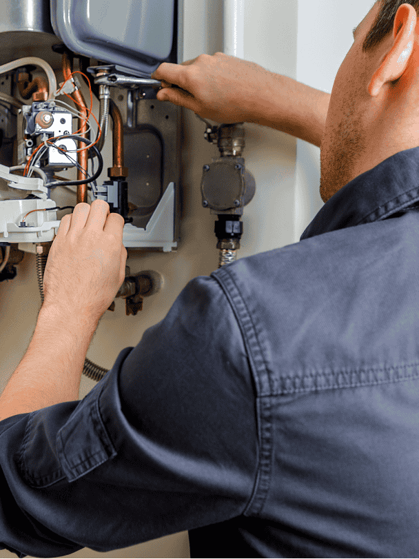 Technician installing a boiler