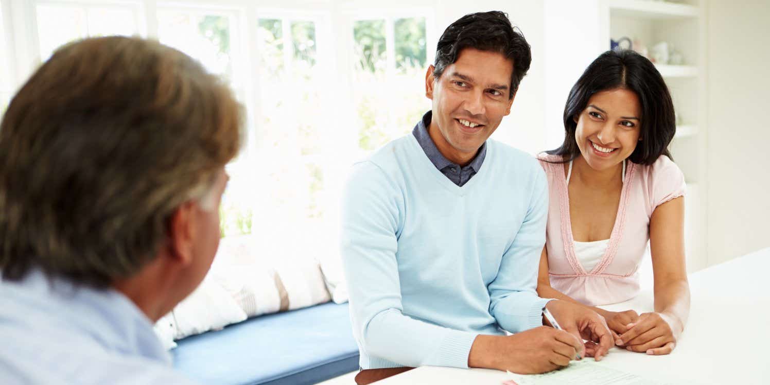 Couple discussing finances with advisor
