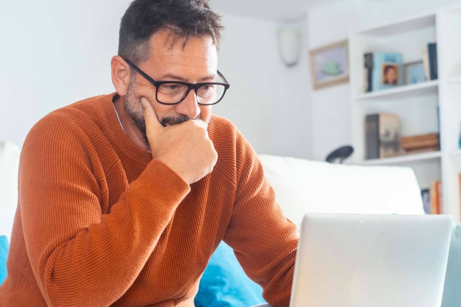 Older man looking at laptop screen