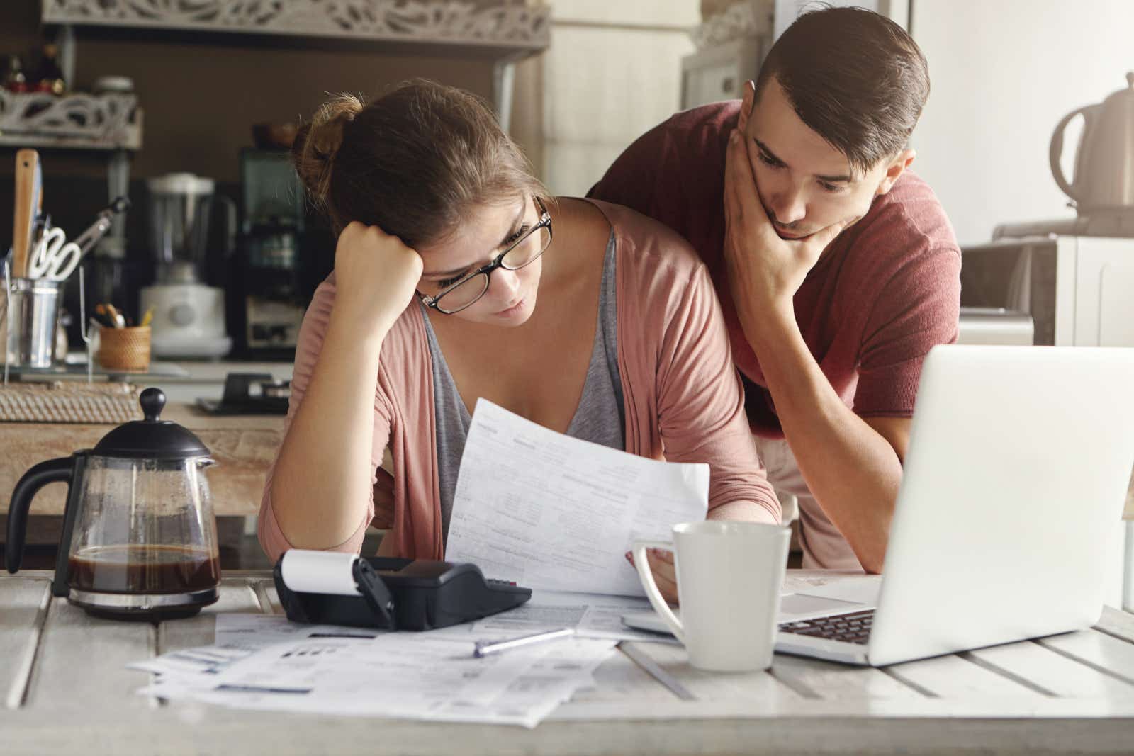 Can you really write of your debts - worried couple with bills