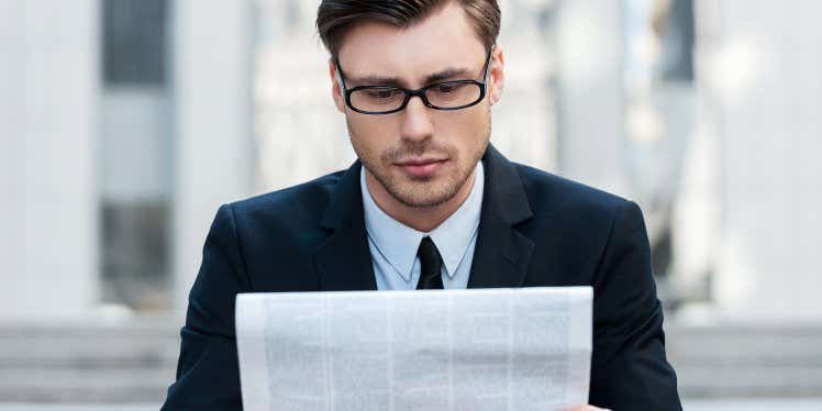 businessman-reading-financial-newspaper