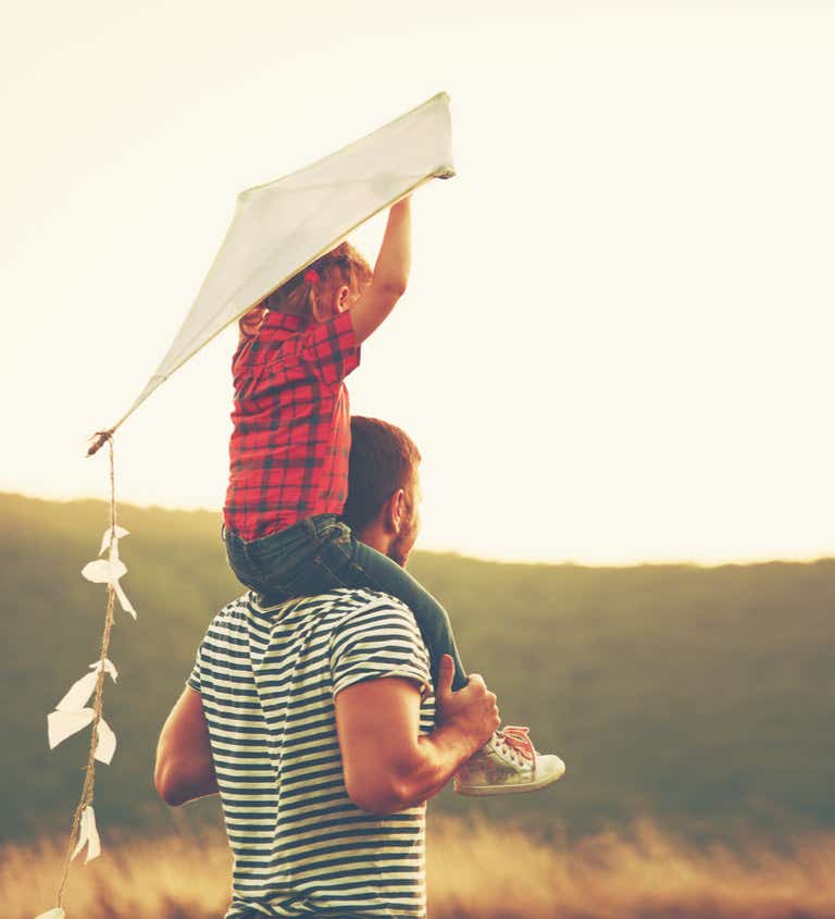Father and son flying kite