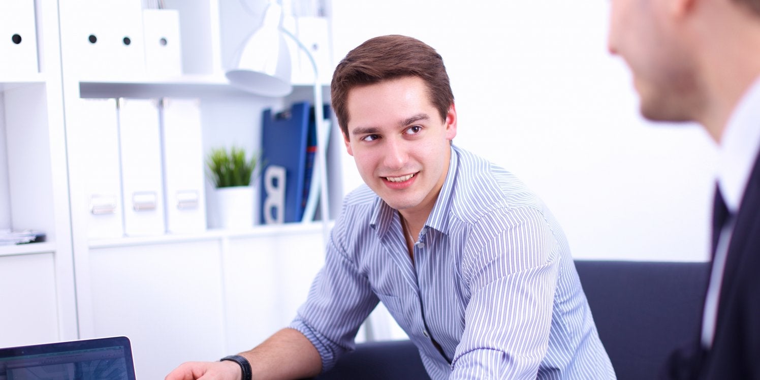 two-businessmen-using-computer
