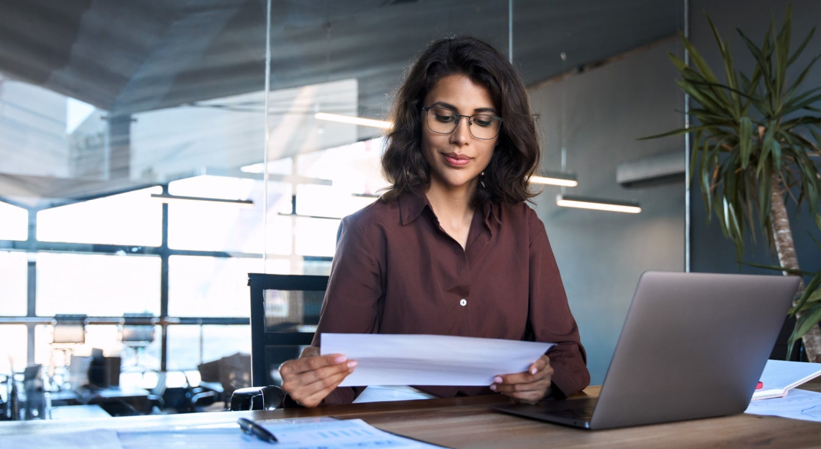 Businesswoman reviewing paperwork