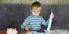 child-calculator-piggy-bank-and-paperwork.