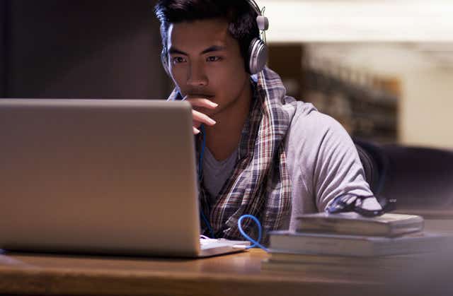 Student credit cards, student at laptop