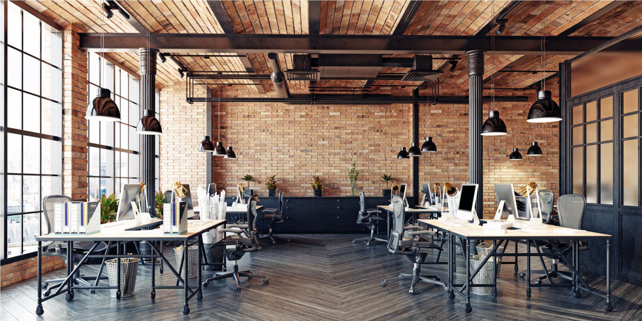 workspace with exposed brick walls, steel beams and arch ceilings