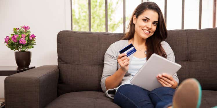 woman-tablet-credit-card-sofa