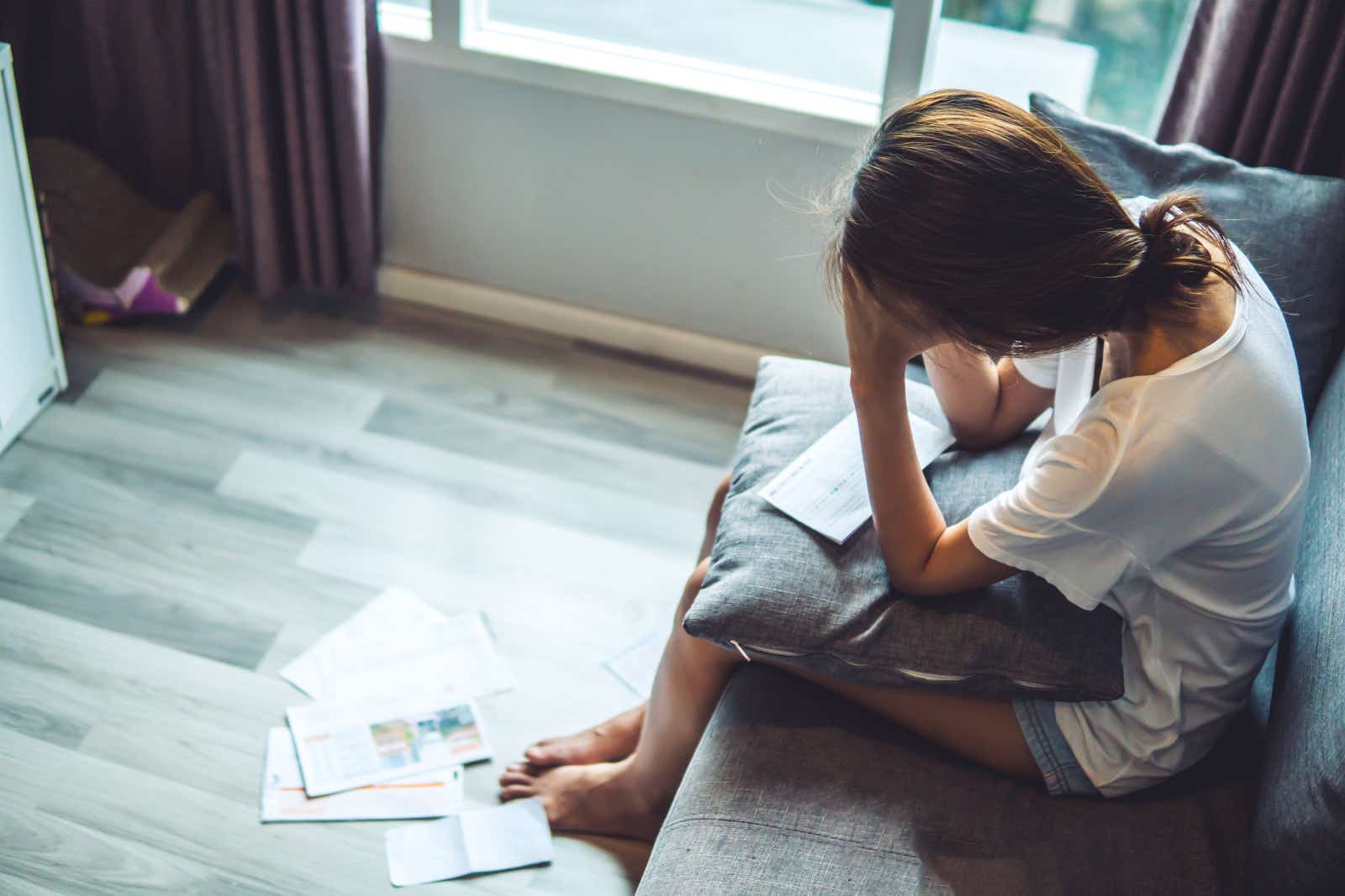 Woman worried about bills and debt rights