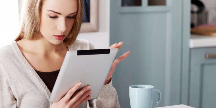 young-woman-on-tablet-in-kitchen