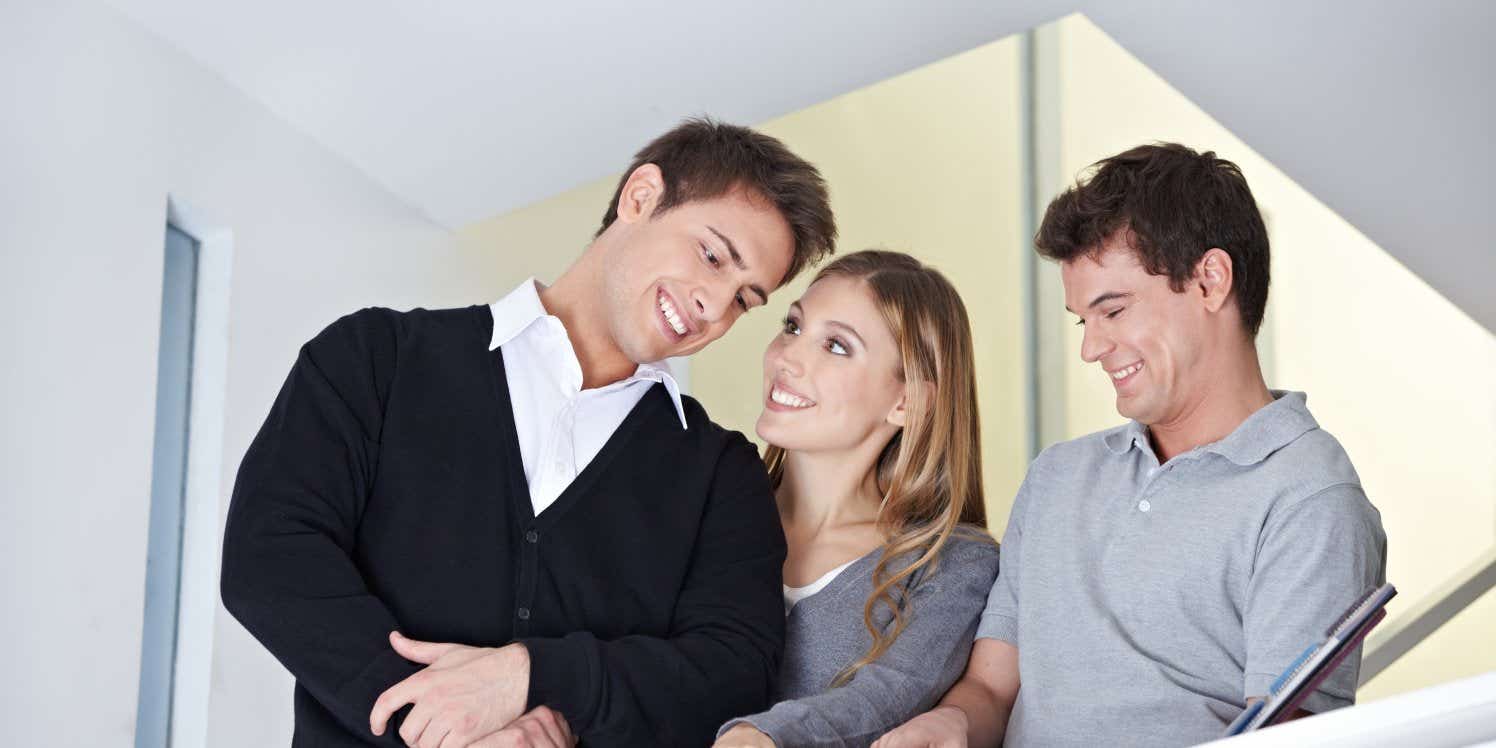 Couple with real estate agent in new home