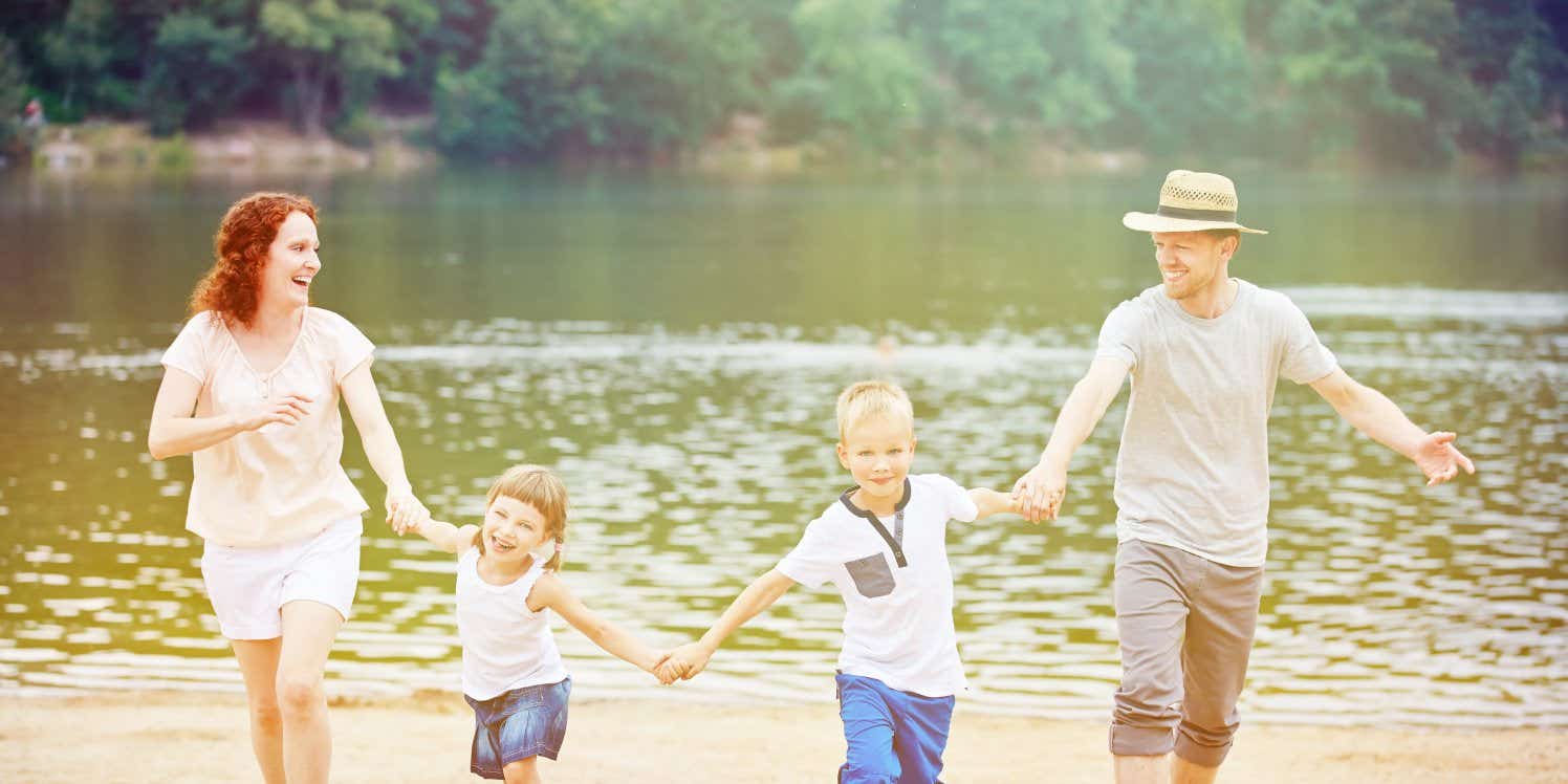 family running by lake