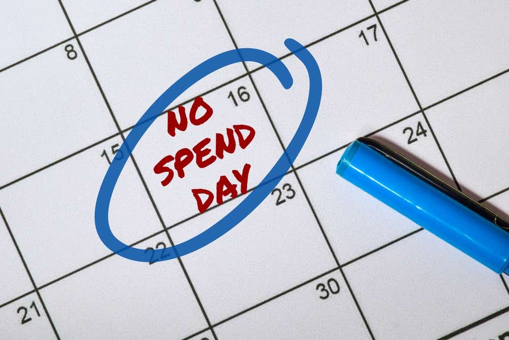 Calendar with 'no spend day' written on the 16th day and a blue circle around it. 