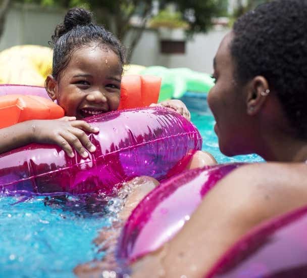 Mother and daughter in pool 