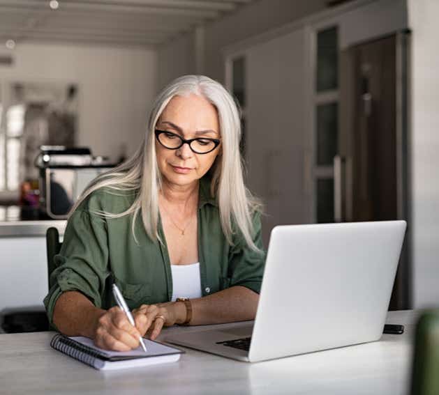 Woman making notes 629 x 567