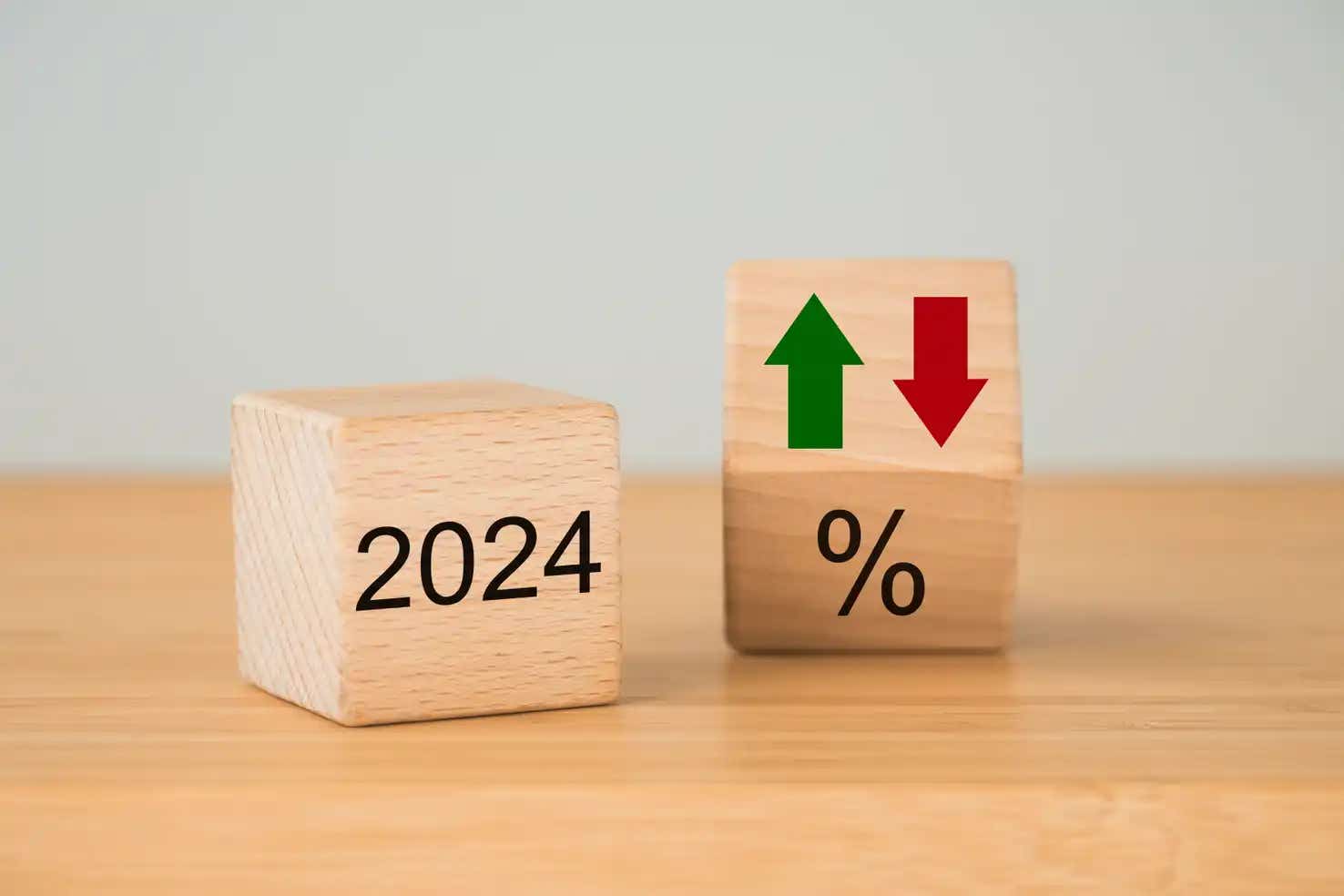 Wooded blocks with an up and down percentage for 2024