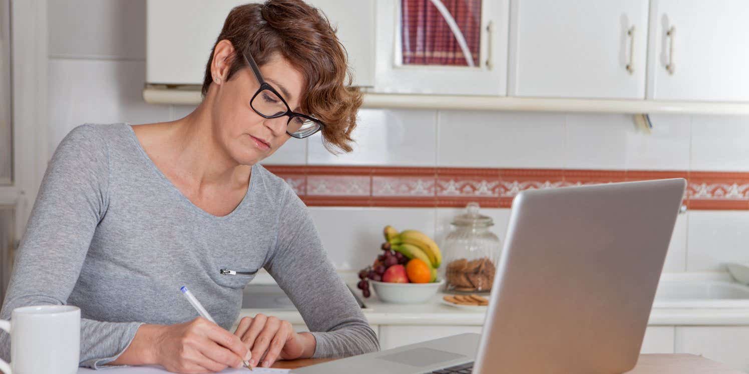 Woman doing paperwork at home