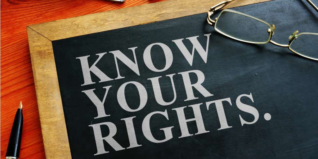 Image of blackboard with text reading "know your rights"