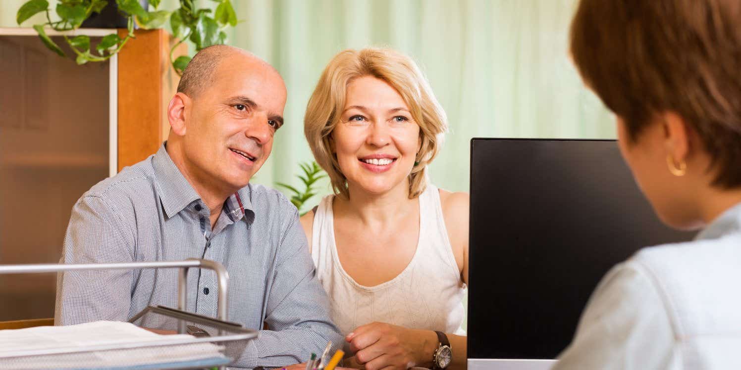 Older couple with financial advisor