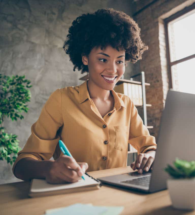 Woman happily typing