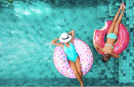 Women relaxing in pool