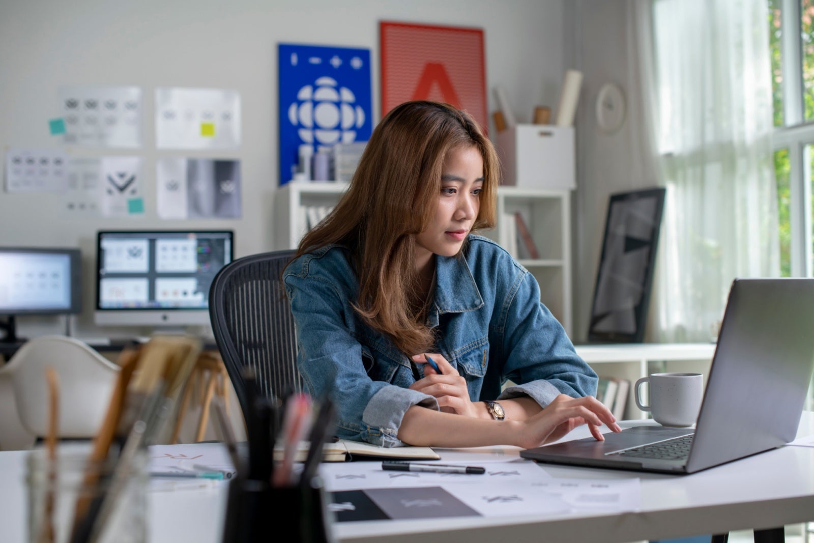 Graphic designer working in her studio