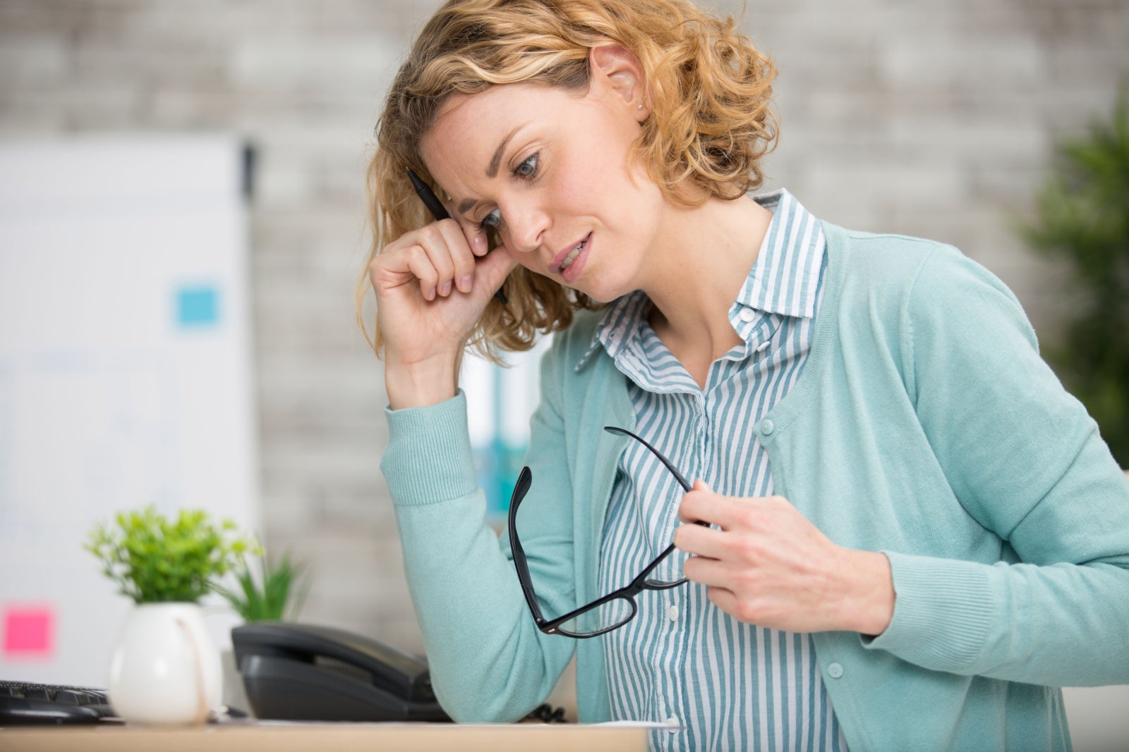 Worried-looking buisnesswoman in modern office