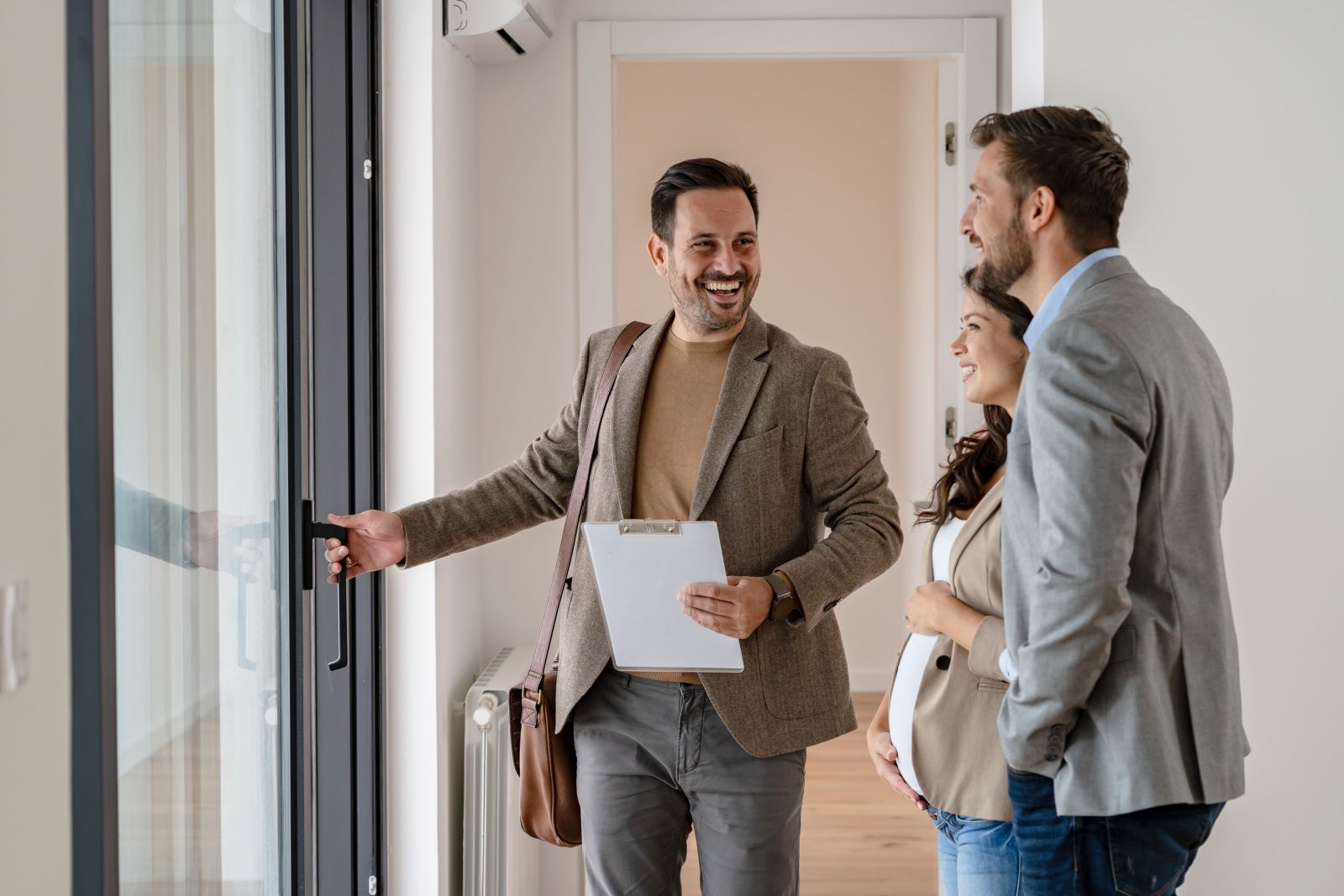 Landlord showing prospective renters around a property.