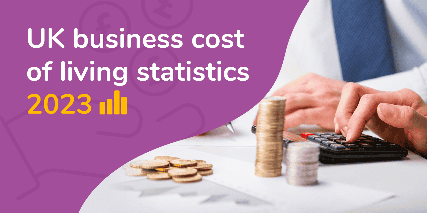 Feature image with the title "UK business cost of living statistics 2023" and a business person at a desk calculating their finances with a pile of money next to them.