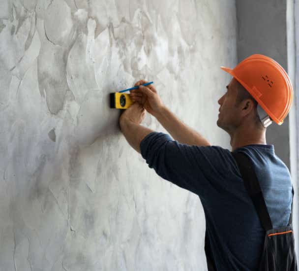 Man measuring a wall